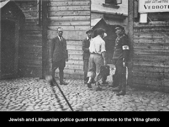 Jewish and Lithuanian police guard the entrance to the Vilna ghetto. 