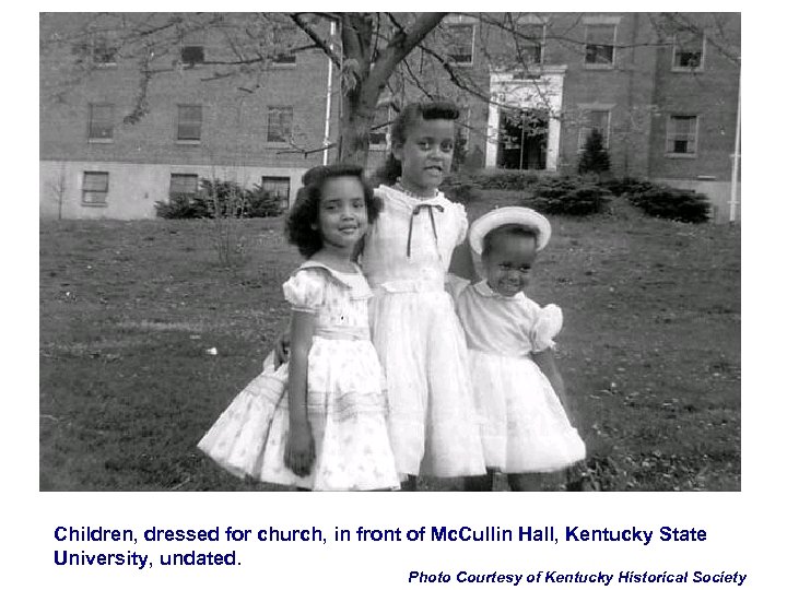 Children, dressed for church, in front of Mc. Cullin Hall, Kentucky State University, undated.