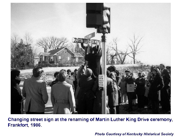 Changing street sign at the renaming of Martin Luther King Drive ceremony, Frankfort, 1986.