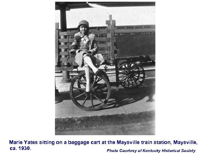 Marie Yates sitting on a baggage cart at the Maysville train station, Maysville, ca.