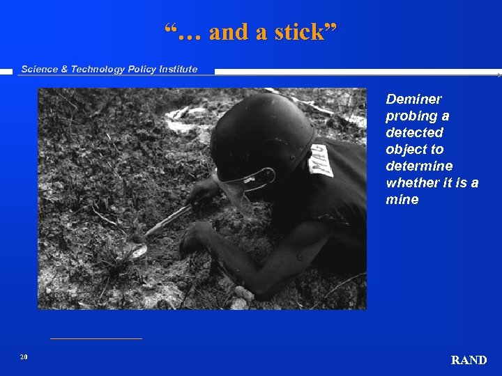 “… and a stick” Science & Technology Policy Institute Deminer probing a detected object