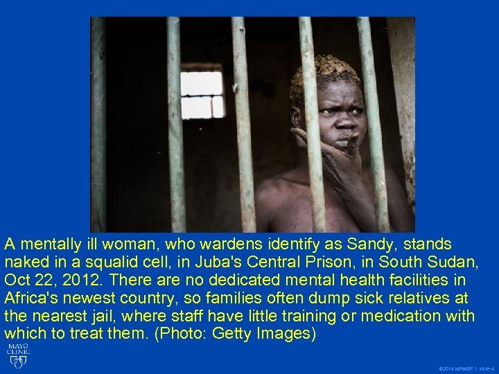 A mentally ill woman, who wardens identify as Sandy, stands naked in a squalid