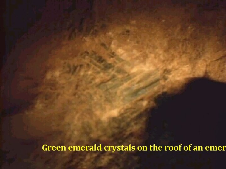 Green emerald crystals on the roof of an emer 