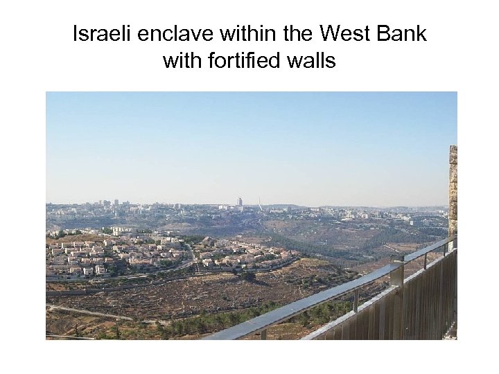 Israeli enclave within the West Bank with fortified walls 
