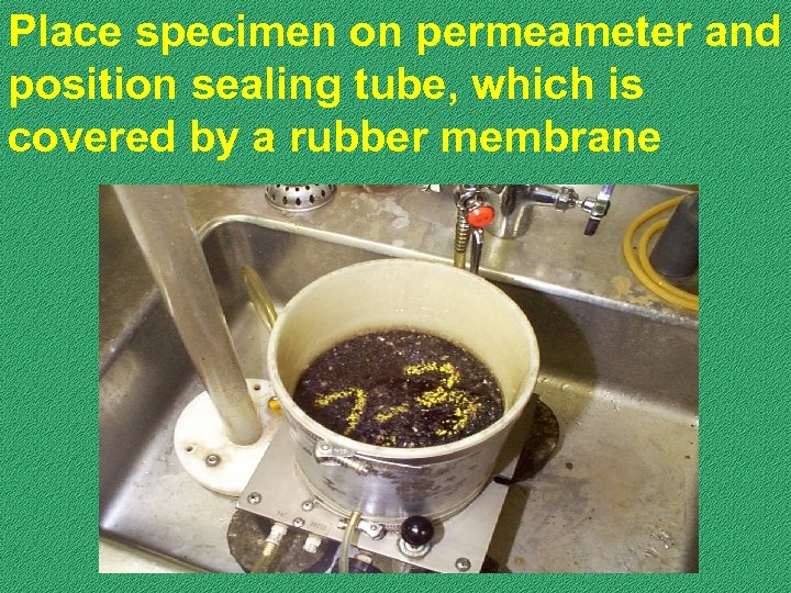 Place specimen on permeameter and position sealing tube, which is covered by a rubber
