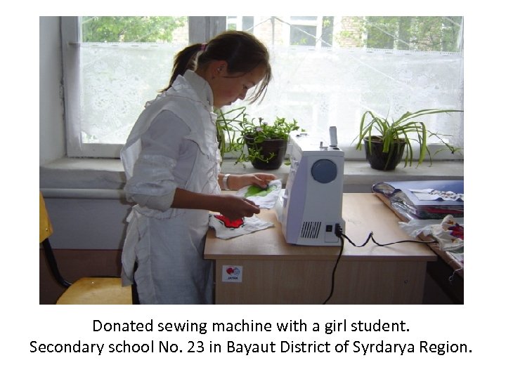 Donated sewing machine with a girl student. Secondary school No. 23 in Bayaut District