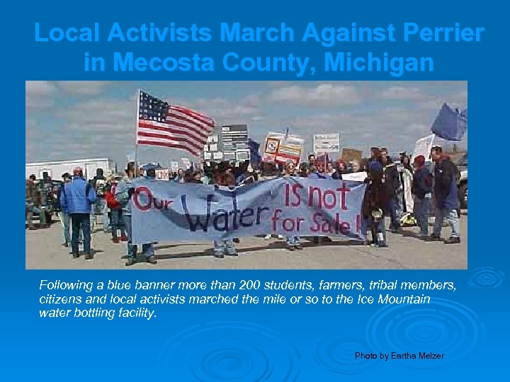 Local Activists March Against Perrier in Mecosta County, Michigan Following a blue banner more