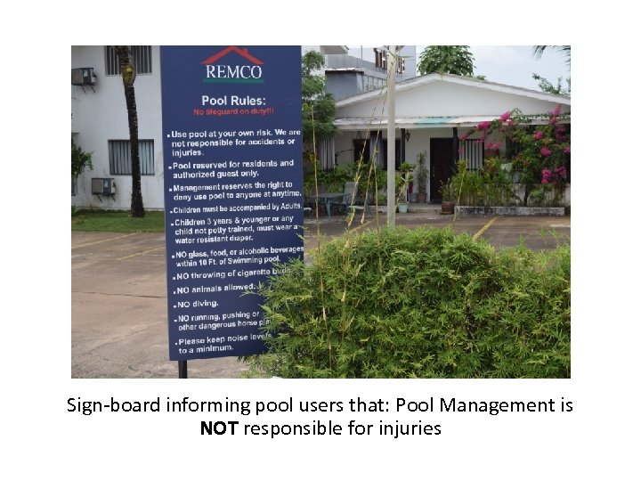 Sign-board informing pool users that: Pool Management is NOT responsible for injuries 
