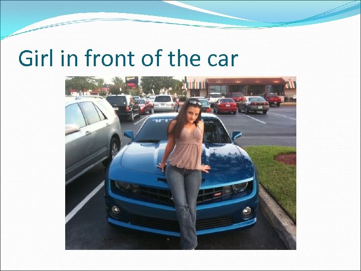 Girl in front of the car 