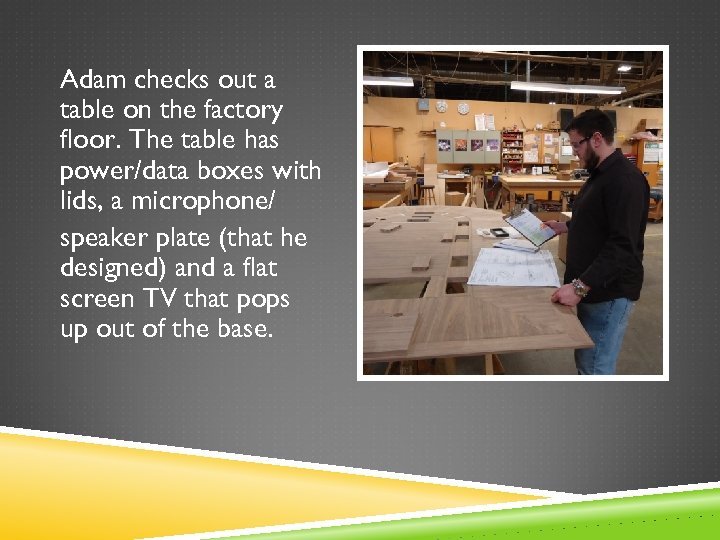 Adam checks out a table on the factory floor. The table has power/data boxes
