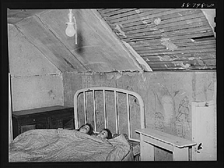 Upstairs bedroom of family on relief, Chicago, Illinois. April 1941 