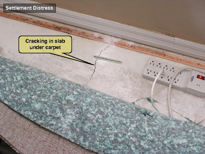 Settlement Distress Cracking in slab under carpet 