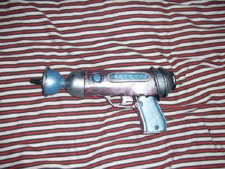 Button Piece of leather cut to shape Plastic wine glasses cut up Base gun