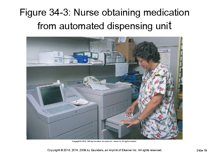 Figure 34 -3: Nurse obtaining medication from automated dispensing unit Copyright © 2018, 2014,