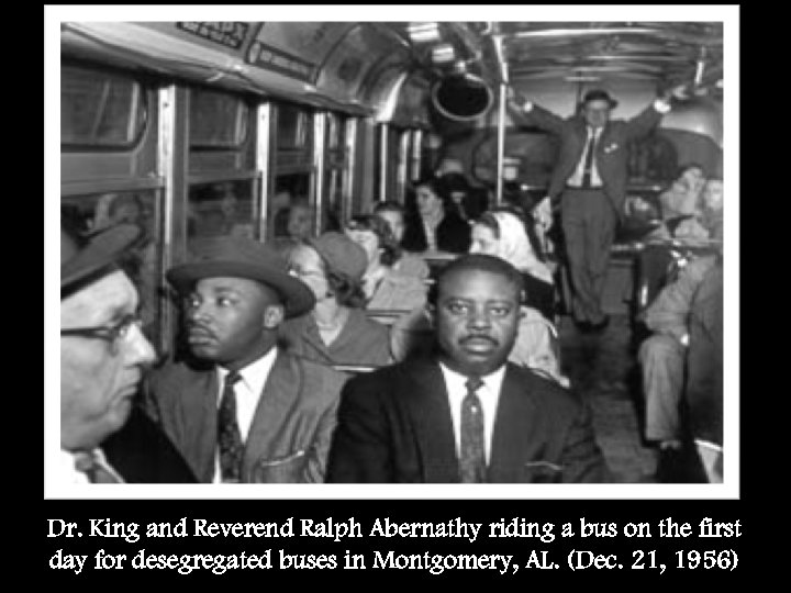 Dr. King and Reverend Ralph Abernathy riding a bus on the first day for