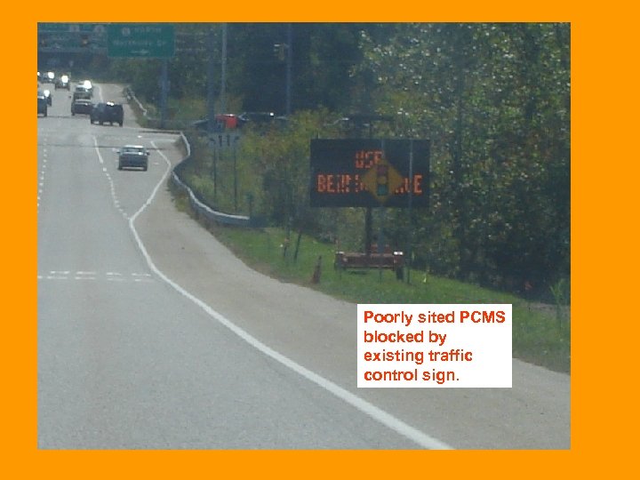 Poorly sited PCMS blocked by existing traffic control sign. 