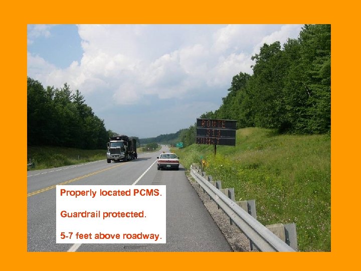 Properly located PCMS. Guardrail protected. 5 -7 feet above roadway. 