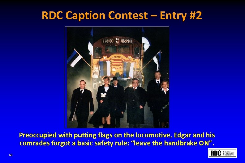 RDC Caption Contest – Entry #2 Preoccupied with putting flags on the locomotive, Edgar