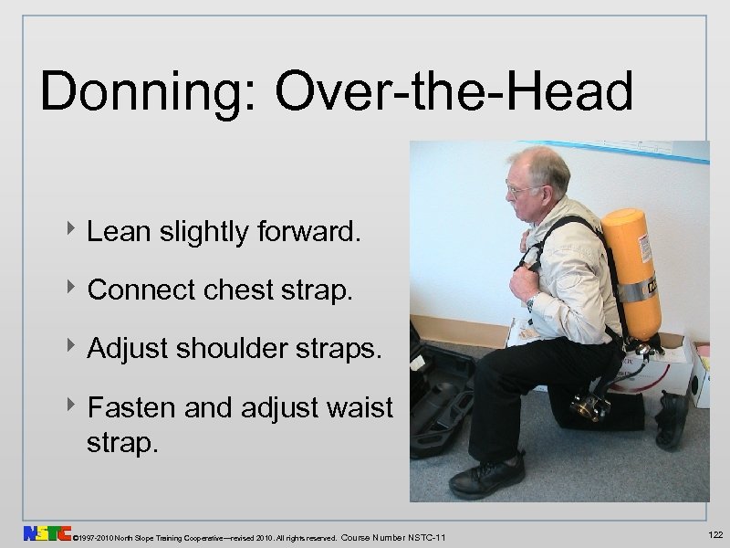 Donning: Over-the-Head ‣ Lean slightly forward. ‣ Connect chest strap. ‣ Adjust shoulder straps.