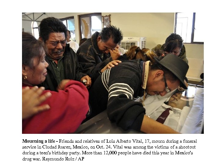 Mourning a life - Friends and relatives of Luis Alberto Vital, 17, mourn during