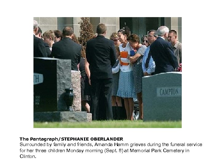 The Pantagraph/STEPHANIE OBERLANDER Surrounded by family and friends, Amanda Hamm grieves during the funeral