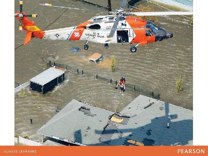 A U. S. Coast Guard helicopter rescues floodstranded victims 