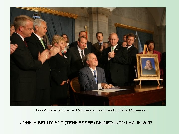 Johnia’s parents (Joan and Michael) pictured standing behind Governor JOHNIA BERRY ACT (TENNESSEE) SIGNED