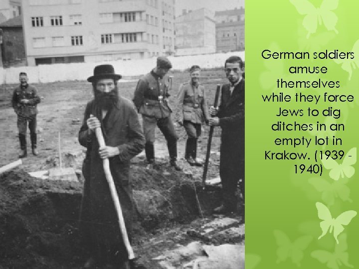 German soldiers amuse themselves while they force Jews to dig ditches in an empty