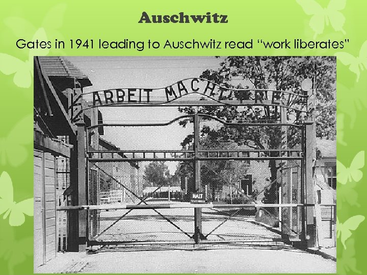 Auschwitz Gates in 1941 leading to Auschwitz read “work liberates” 