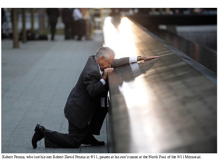 Robert Peraza, who lost his son Robert David Peraza in 9/11, pauses at his