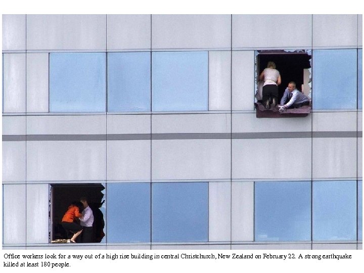 Office workers look for a way out of a high rise building in central