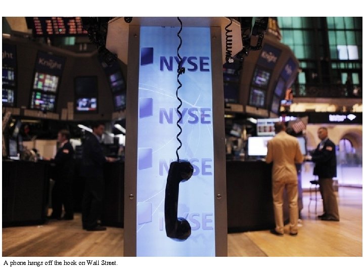 A phone hangs off the hook on Wall Street. 