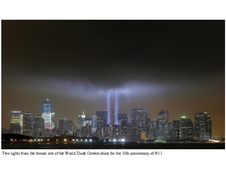 Two lights from the former site of the World Trade Centers shine for the