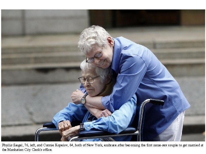Phyllis Siegel, 76, left, and Connie Kopelov, 84, both of New York, embrace after