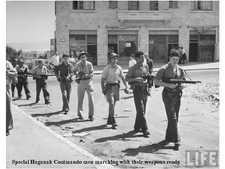 Special Haganah Commando men marching with their weapons ready 