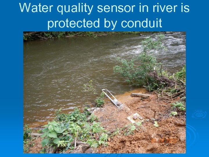 Water quality sensor in river is protected by conduit 