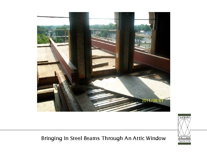 Bringing In Steel Beams Through An Attic Window 