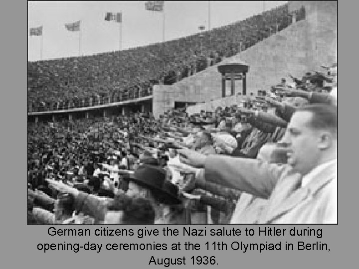 German citizens give the Nazi salute to Hitler during opening-day ceremonies at the 11