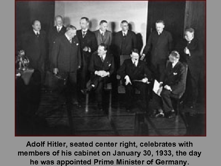 Adolf Hitler, seated center right, celebrates with members of his cabinet on January 30,