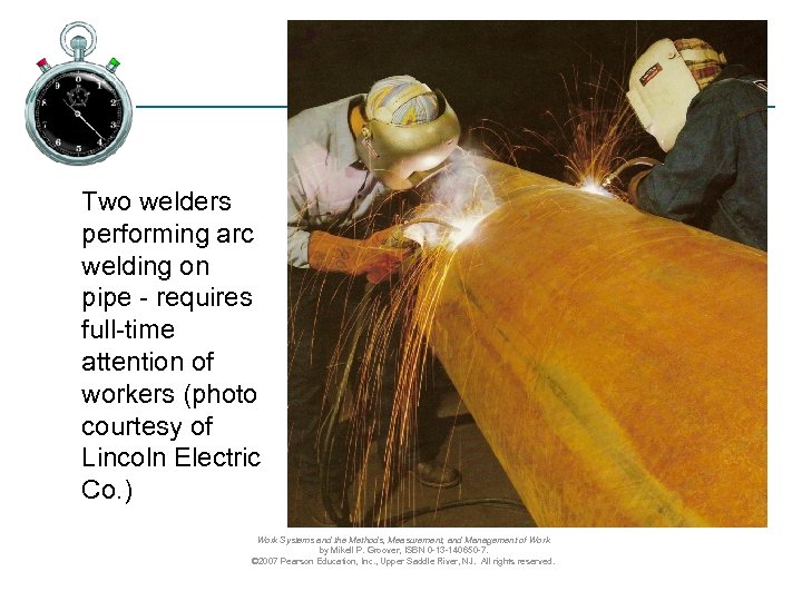 Two welders performing arc welding on pipe - requires full-time attention of workers (photo