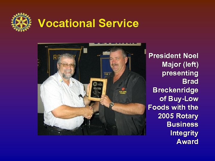 Vocational Service President Noel Major (left) presenting Brad Breckenridge of Buy-Low Foods with the