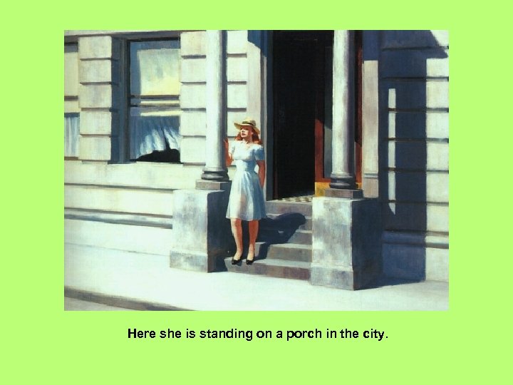 Here she is standing on a porch in the city. 