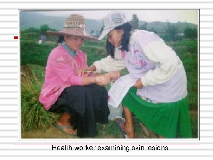 Health worker examining skin lesions 