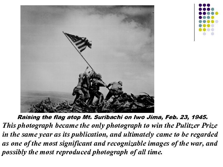 Raising the flag atop Mt. Suribachi on Iwo Jima, Feb. 23, 1945. This photograph