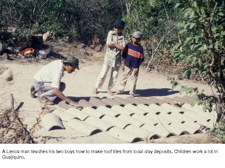A Lenca man teaches his two boys how to make roof tiles from local