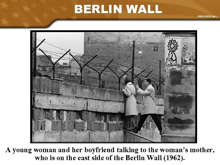 BERLIN WALL A young woman and her boyfriend talking to the woman’s mother, who