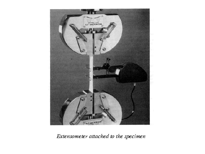 Extensometer attached to the specimen 