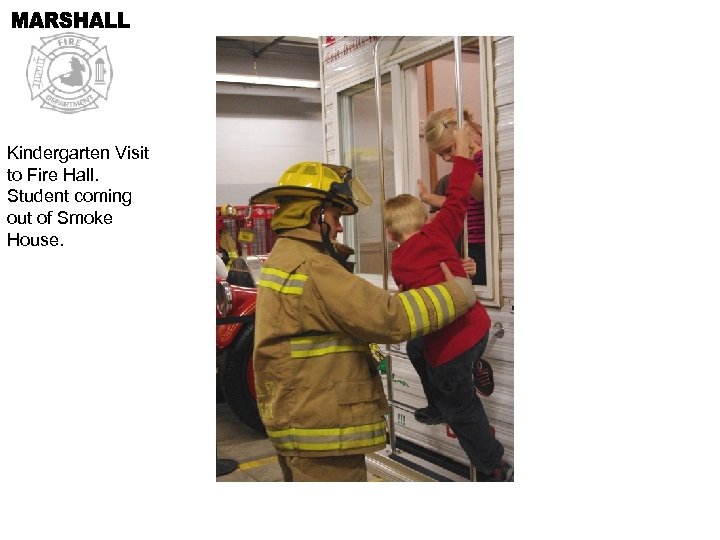 Kindergarten Visit to Fire Hall. Student coming out of Smoke House. 