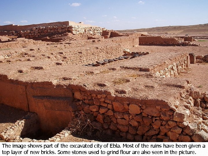 The image shows part of the excavated city of Ebla. Most of the ruins