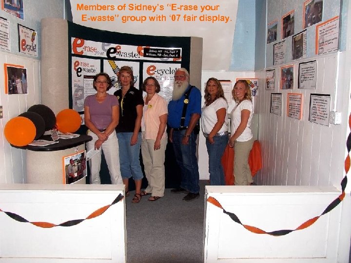 Members of Sidney’s “E-rase your E-waste” group with ‘ 07 fair display. 